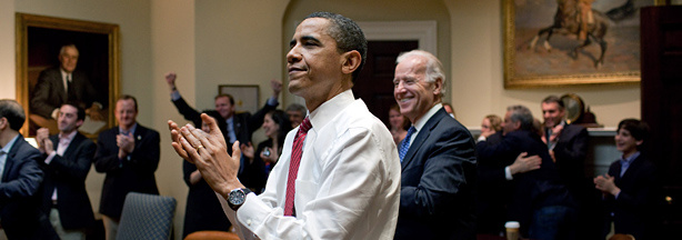 President Barack Obama, Vice President Joe Biden, and senior staff applaud in the Roosevelt Room of the White House, as the U.S. House of Representatives passed the health care reform legislation March 21, 2010 in Washington, DC. The proposed legislation has become the signature piece of Obama's domestic policy agenda and has eluded U.S. presidents dating back to Theodore Roosevelt.