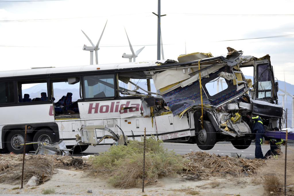 APTOPIX Fatal Tour Bus Crash Workers prepare to haul away a tour bus that crashed into a semitrailer in October 2016 on Interstate 10 near Palm Springs, Calif. Officials believe the accident, which killed 13 people, involved the drivers of both vehicles falling asleep behind the wheel.