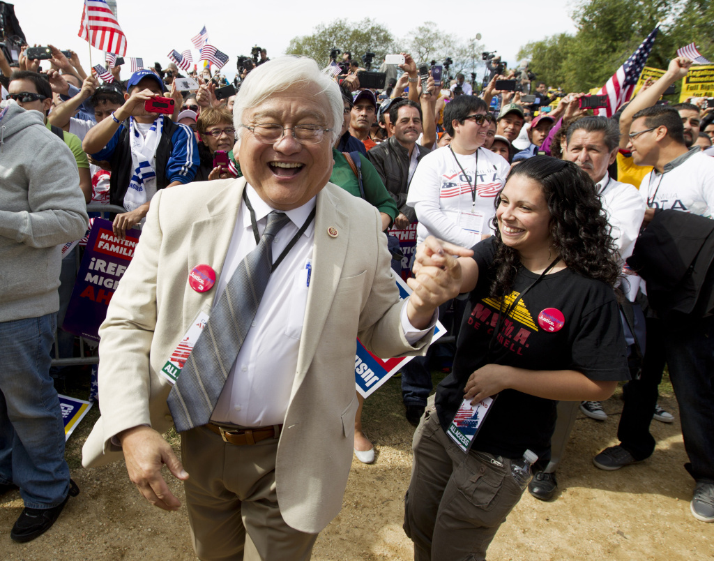 Rep. Mike Honda, D-Calif., dances to the music of Los Tigres del Norte during an immigration rally on the National Mall in Washington in October 2013.