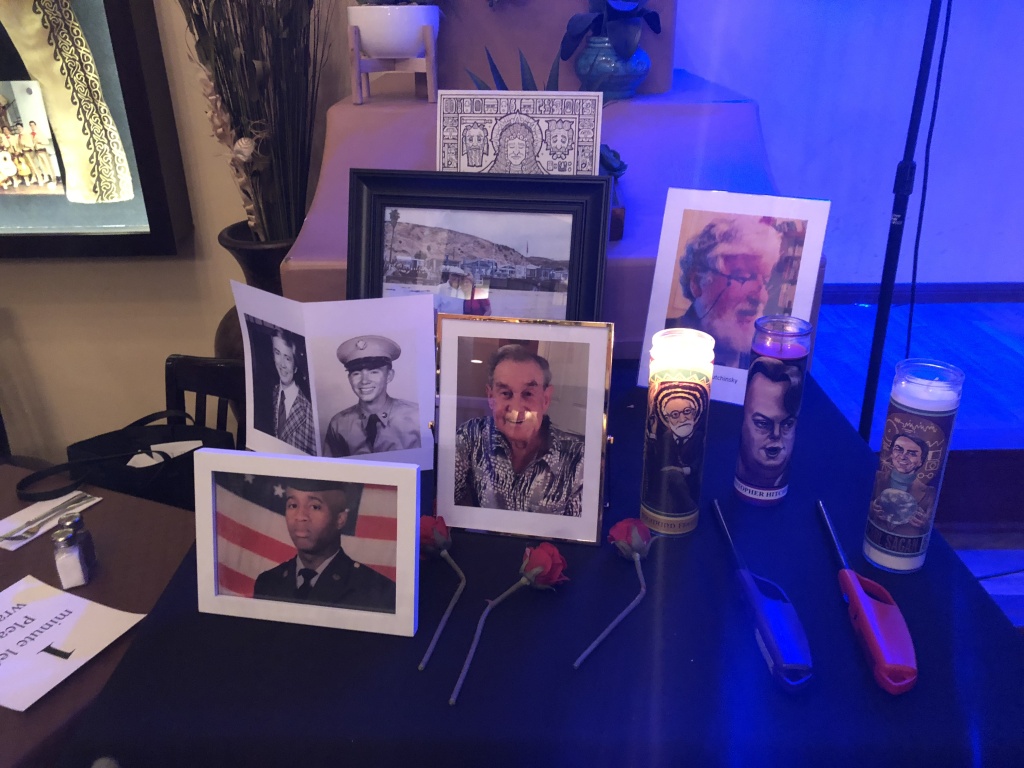 Secular Altar Participants put photos and candles on a “secular honoring table” to remember dead loved ones.