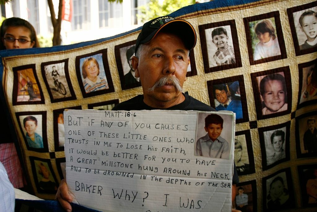 LA Archdiocese Agrees To $660 Million Settlement In Clergy Abuse Suit Frank Zamorro holds a placard with a picture of his son Dominic, who was allegedly abused by Father Michael Baker at age seven, during a press conference outside the Los Angeles County Courthouse where a record $660 million settlement between the Archdiocese of Los Angeles and plaintiffs who allege they were sexually abused by clergy members is to be presented for approval by a judge on July 16, 2007 in Los Angeles, California. The proposed settlement plus $114 million in related settlements to which the church has agreed increases the archdiocese's financial liability over $774 million, the biggest payout since the church sex abuse scandal broke in Boston in 2001. The Archdiocese reportedly plans to raise the $660 million through the sale of some of its buildings, insurance payments, investments, and loans and contributions from some of the religious orders. In Boston, the church settled for $157 million, in Portland, Oregon it made a $129 million settlement, and in 2005, the diocese in Orange County, California paid $100 million for sex abuse claims. Five dioceses facing large settlements have filed for bankruptcy protection. Mahony apologized to victims, many who were children when they were sexually abused by clergy in the Los Angeles Archdiocese, after the settlement was announced and acknowledged he made mistakes handling the scandal.