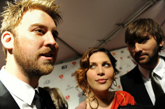 Musicians Charles Kelley (R), Hillary Scott (C) and Dave Haywood of group Lady Antebellum arrive for the Musicares Person of the Year Dinner honoring Neil Young, in Los Angeles, on Jan. 29, 2010.