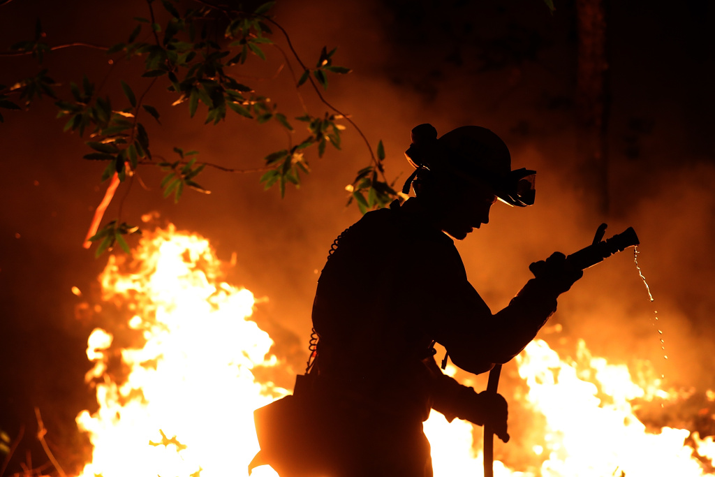 Multiple Wildfires Destroy Homes, Threaten California Wine Country CalFire firefighter Trevor Smith battles the Tubbs Fire on October 12, 2017 near Calistoga, California.