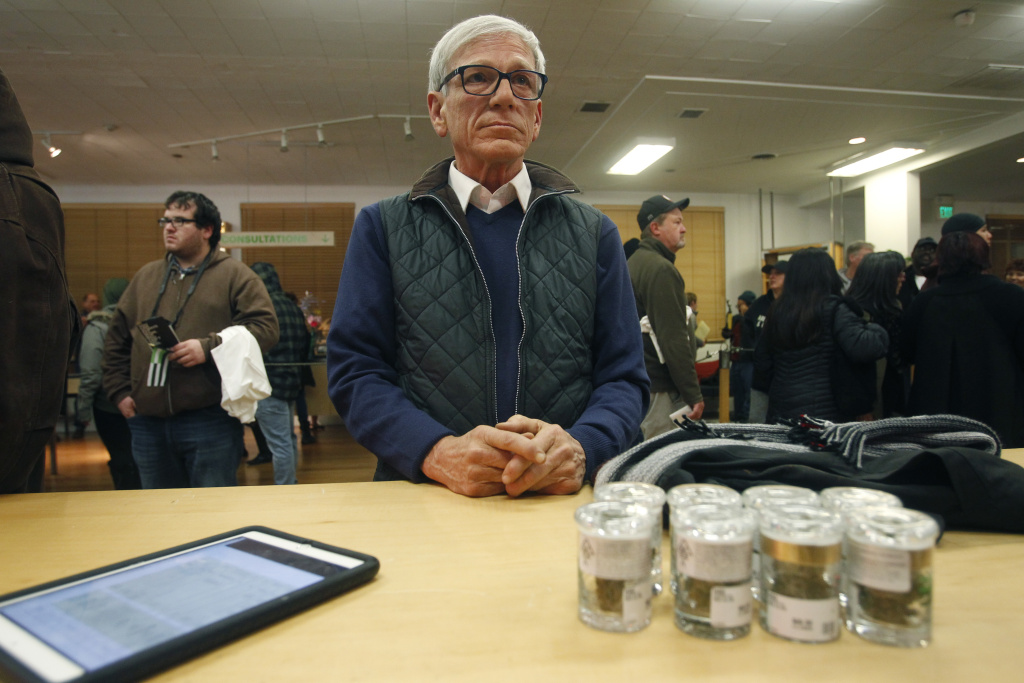 California Marijuana-Open for Business A customer, who declined to give his name, waits for his order to be filled at Harborside marijuana dispensary, Monday, Jan. 1, 2018, in Oakland, Calif.