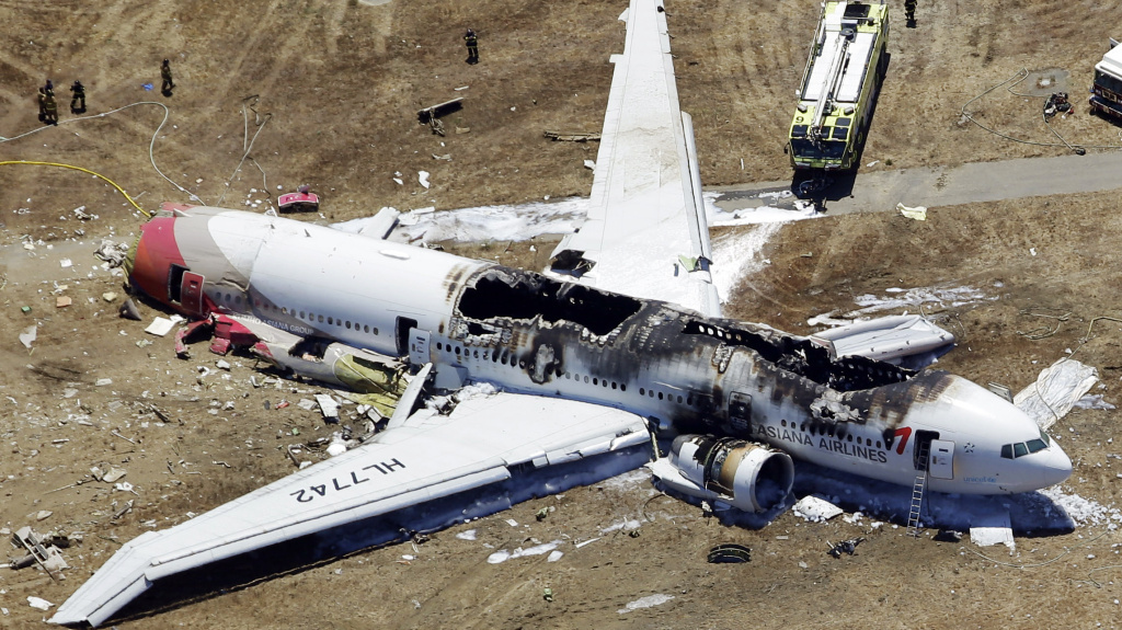 The wreckage of Asiana Flight 214, a Boeing 777 airliner, is seen after it crashed at the San Francisco International Airport Saturday. The crash-landing killed two teenage Chinese girls, the airline says.