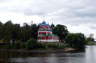 A day after leaving Moscow by cruise, travelers can see colorful churches along the forested banks of the Volga River. They share the banks with mansions of Russia's nouveau riche.