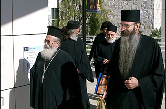 Mercer 7442 Monks of St. Catherine's at the Getty. Leading the way, His Eminence Archbishop Damianos (L) and Father Justin, holding a bag of basil, used in a blessing of the exhibit.