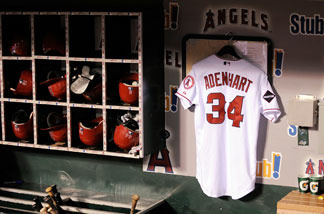 The jersey of Los Angeles Angels pitcher Nick Adenhart, who was killed on April 9, 2009 in a car crash, hangs in the dugout during the baseball game against the Boston Red Sox at Angel Stadium April 10, 2009 in Anaheim, California.