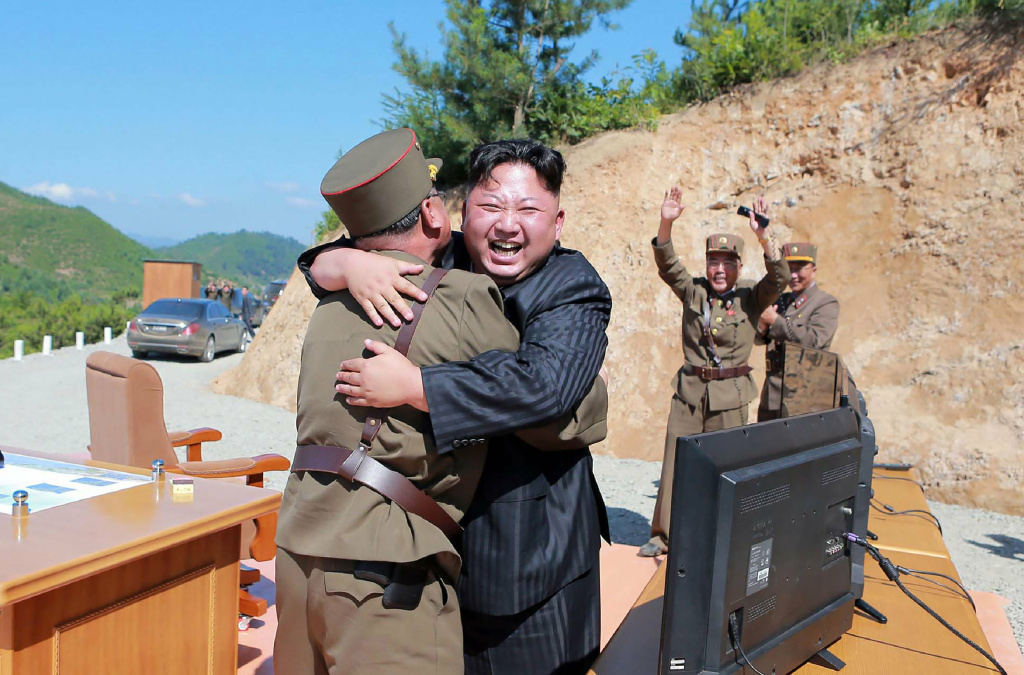 North Korea Kim Jong Un This picture taken on July 4, and released by North Korea's official Korean Central News Agency on July 5, shows North Korean leader Kim Jong Un celebrating a successful test-fire of the intercontinental ballistic missile Hwasong-14.