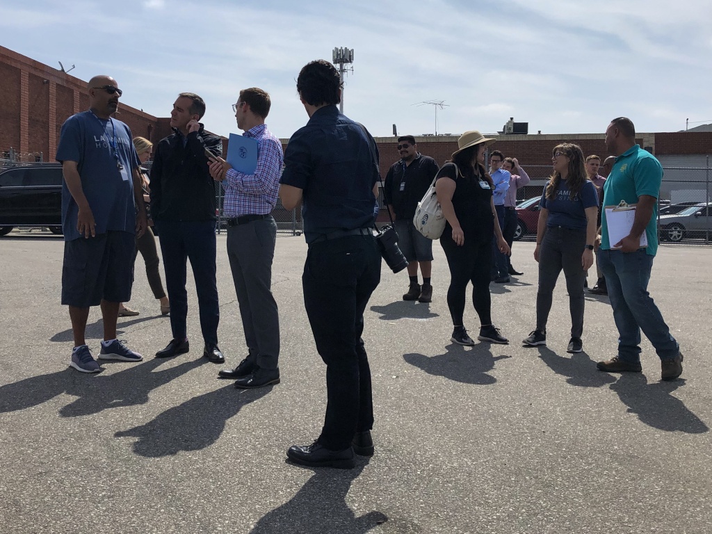 Los Angeles Mayor Eric Garcetti, second from left, and others prepare for homeless outreach in North Hollywood in early July. (Matt Tinoco/KPCC) Los Angeles Mayor Eric Garcetti, second from left, and others prepare for homeless outreach in North Hollywood in early July. (Matt Tinoco/KPCC)