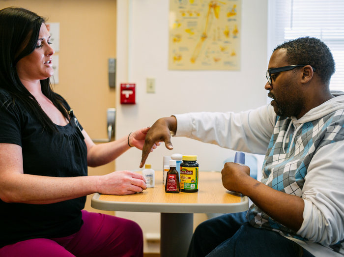 Occupational therapist Lydia Bongiorni works with Troy Hodge on grasping and lifting objects at a rehabilitation center in Gwynn Oak, Md. Occupational therapist Lydia Bongiorni works with Troy Hodge on grasping and lifting objects at a rehabilitation center in Gwynn Oak, Md.