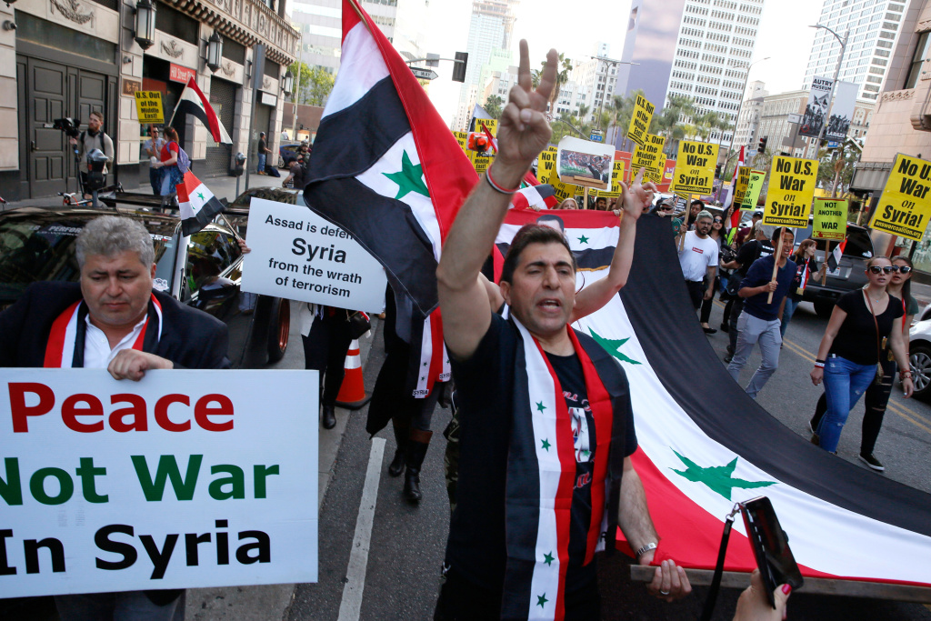 United States Syria Syrian-Americans express their anger at the missile strike on their homeland, during an anti-war rally opposing the military strikes by western countries in Syria, in downtown Los Angeles Saturday, April 14, 2018. On Saturday, those commemorating Syria's independence from France in 1946, called the missile strikes by the U.S., Britain and France illegal.