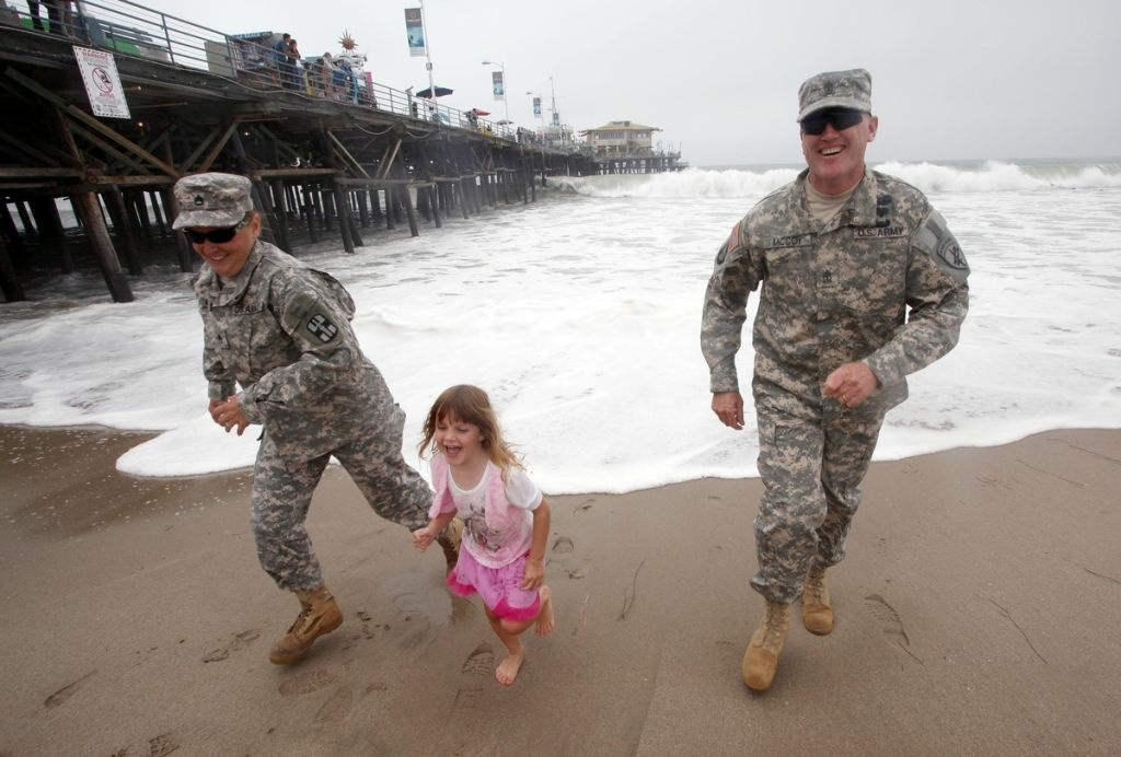 Tim McCoy First Sergeant Tim McCoy, wife Amy, and daughter Sami in Santa Monica. This shoot was for HeartsAprart.org.