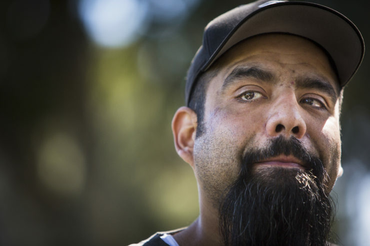 Dennis Cruz Dennis Cruz tears up while telling his story of his multiple injuries from working at the Tesla factory in Fremont, CA on March 11, 2018. Cruz' pay was cut in half while on workers compensation after an adhesive got in his eyes at the plant, leaving him homeless for months.
