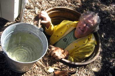 TreePeople's Jim Hardie goes down into an access tube next to the groups' cistern in Coldwater Canyon Park. The cistern holds more than 200,000 gallons of water - enough for outdoor operations the rest of the year.