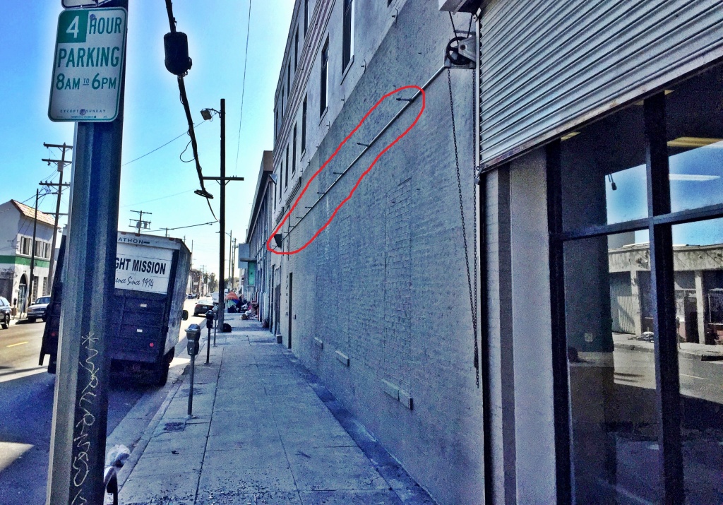 Steve Lee's building at 470 E. Third St., with the water sprinklers circled. Steve Lee's building at 470 E. Third St., with the water sprinklers circled.