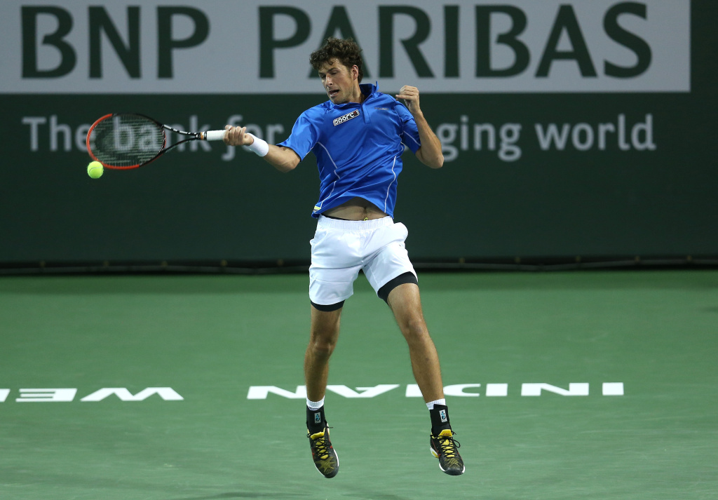 BNP Paribas Open - Day 7 Robin Haase of the Netherlands hits a return to Grigor Dimitrov of Bulgaria during the BNP Paribas Open at Indian Wells Tennis Garden on March 9, 2014 in Indian Wells, California.