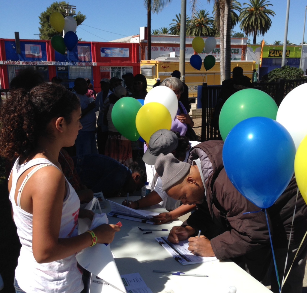 South LA residents sign in to attend the South LA Power Festival, an event organized around providing information on health care coverage.