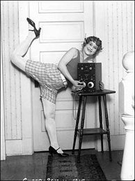 Mercer 8035 She just can't wait to hear this week's Dinner Party Download! According to the LAPL archive, she's 'a young woman almost dancing as she holds her radio and listens through earphones.'