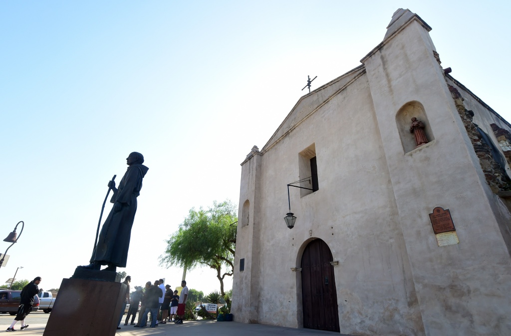 Ernesto Salas, chief of a group of Kizh Nation Indians leads a ceremony honouring their ancestors beside the statue of Father Junipero Serra which stands in front of the San Gabriel Mission in San Gabriel, California on September 23, 2015. Photo of the San Gabriel Mission.