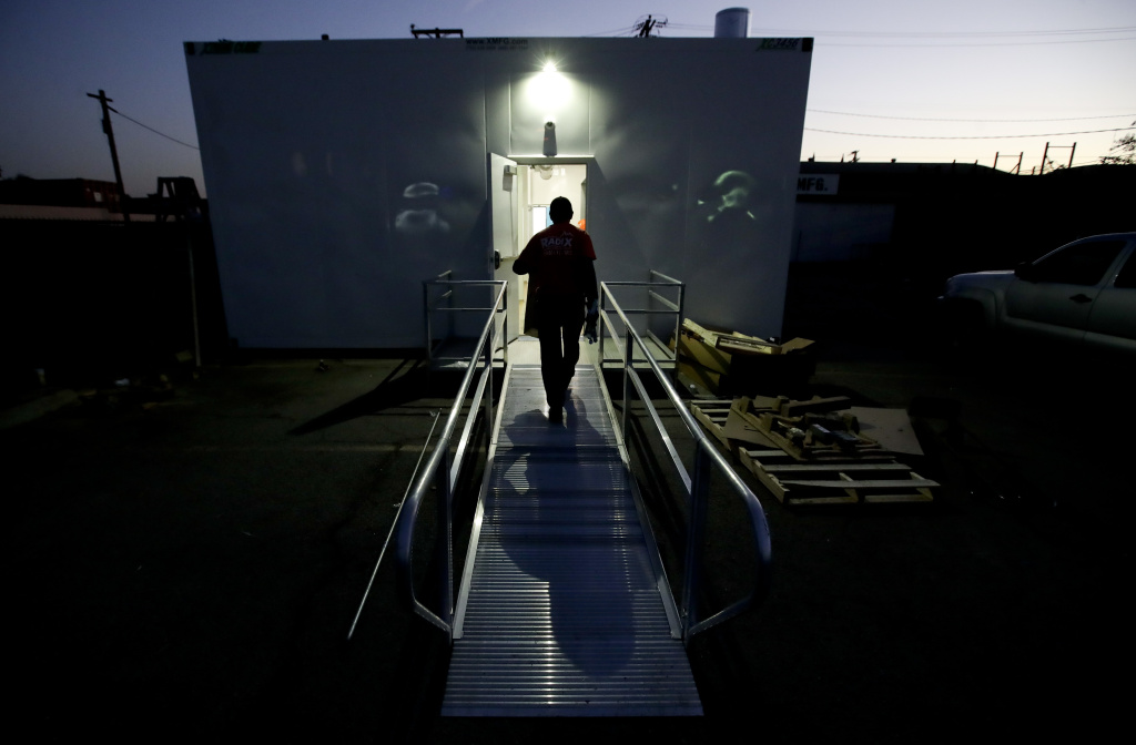 California Marijuana Licenses Workers load supplies and hardware into the Moxie brand store Thursday, Dec. 14, 2017, in Lynwood, California.