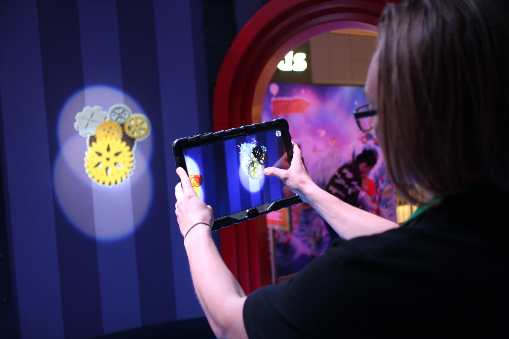 HGTV Santa HQ castmember, Jakob Hatch, demonstrates an augmented reality feature of the attraction at Lakewood Center mall. HGTV Santa HQ castmember, Jakob Hatch, demonstrates an augmented reality feature of the attraction at Lakewood Center mall.