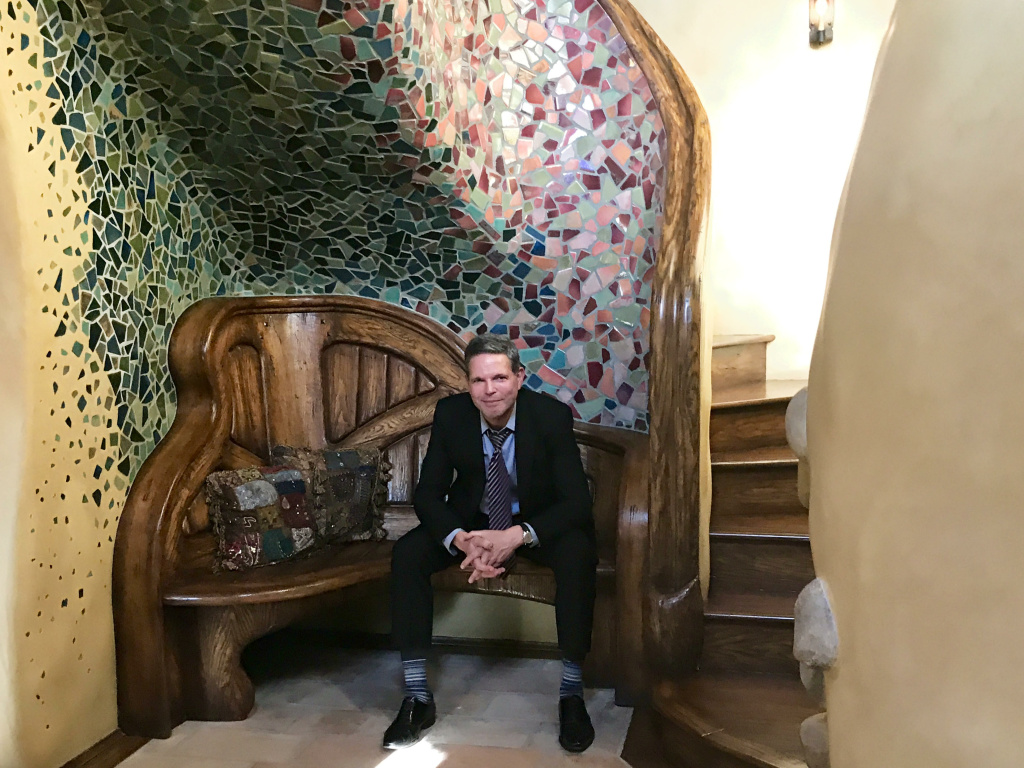 Michael Libow seated in front of the broken tile mosaic and staircase that greets guests from the front door of his Witch home. Michael Libow seated in front of the broken tile mosaic and staircase that greets guests from the front door of his Witch home.