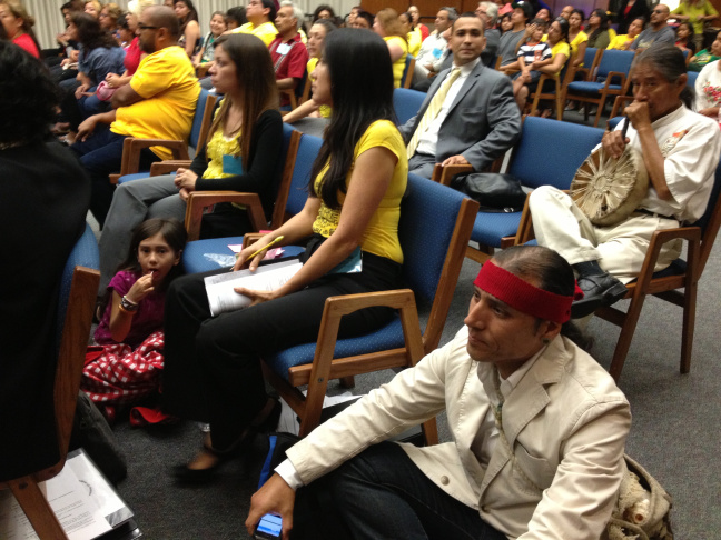 Principal, Marcos Aguilar, sits on the floor as Board members of the Los Angeles County Office of Education debate his school's appeal to have its charter license renewed. 