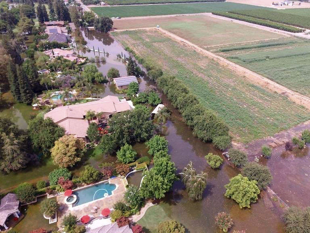Central California Flooding This June 25, 2017, photo taken by an unmanned aerial vehicle and released by the Tulare County Sheriff's Office shows flooding from the Kings River at the Kings River Golf and Country Club in Kingsburg, Calif. The Kings River began to flood about 25 miles (40 kilometers) north of Fresno as temperatures soared, melting snow in the Sierra Nevada and sending it downstream.