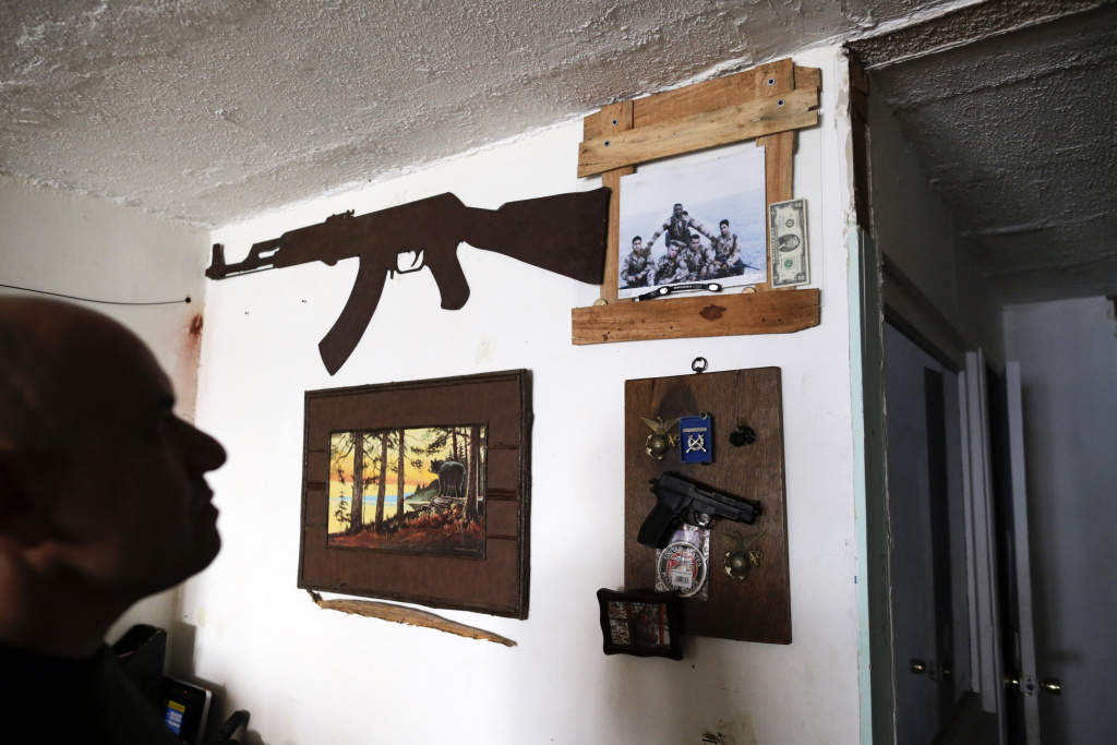 Mexico Deported US Veterans U.S. Marine veteran Antonio Romo — on Feb. 13, 2017 — looks at a replica of a pistol and other military items from his time in the service, mounted on his apartment wall in Tijuana, Mexico. Romo, who says he turned to alcohol and narcotics to try to quiet his nightmares and made multiple suicide attempts, fell into dealing and was arrested for selling cocaine. After getting out of prison in 2008, Romo was deported to Mexico, from where he had migrated without permission at age 12.