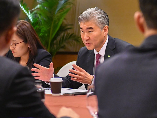 Sung Kim In this photo released by the U.S. State Department, U.S. Ambassador to the Philippines Sung Kim talks with members of the North Korean delegation during a working group meeting on Monday in Singapore.