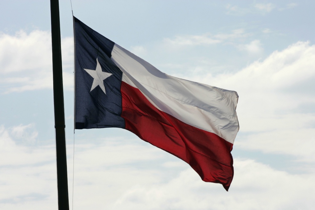 The Texas flag flies at Texas Memorial Stadium in Austin.