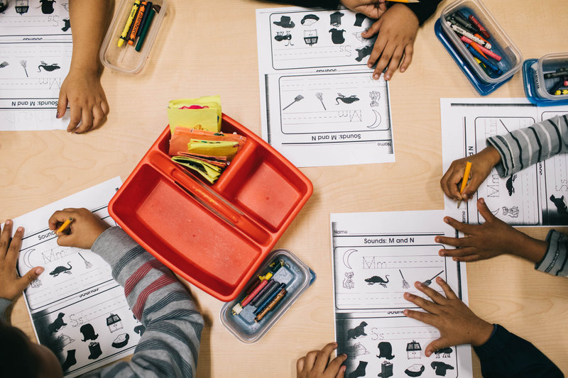 npr-7_slide-63749f37bcf2a88b03c7c9b34f8fea3e5c5b5920-s800-c85.jpg Students at Las Familias Del Pueblo practice sentence structure and language.