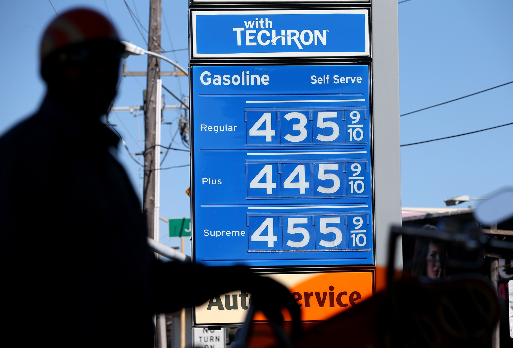 California Governor Gavin Newsom is requesting an investigation into why the state's gas prices have become so high. Gas prices are displayed as a motorcyclist pumps gas into his motorcycle at a Chevron gas station on March 1, 2013 in San Francisco, California. The California Board of Equalization voted on Thursday to implement a statewide excise tax on gasoline starting July 1 that will increase the tax by 3.5 cents to 39.5 cents per gallon.