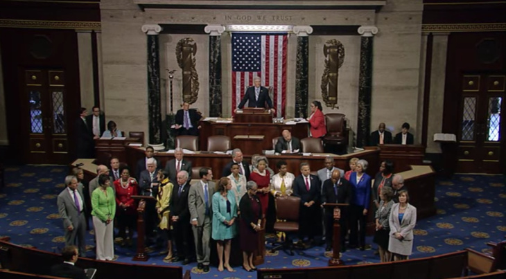 Members of the House gather as Rep. John Lewis (D-GA) delivers a speech declaring that lawmakers would conduct a sit-in until they were able to vote on gun legislation. 