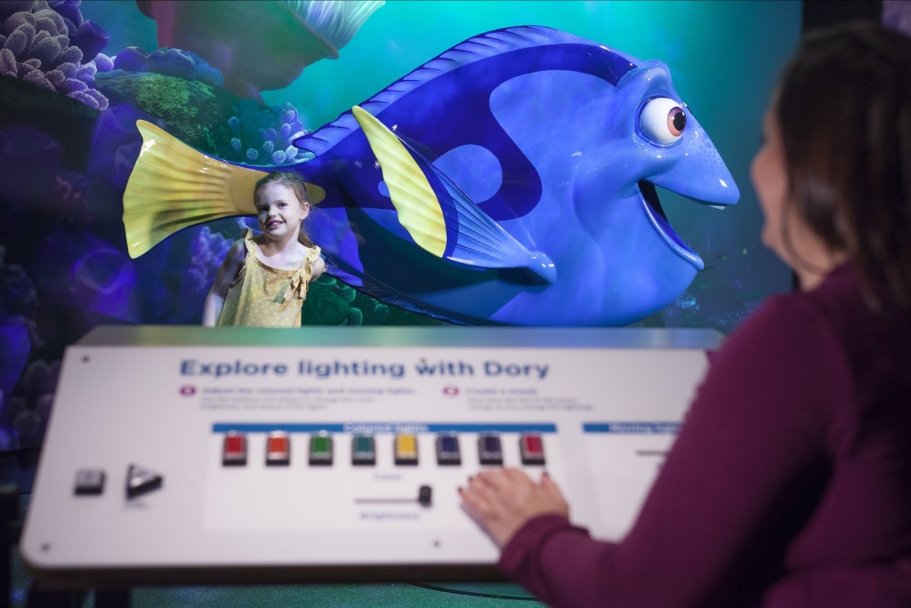 Visitors adjust the lighting for their photo with Dory. Visitors adjust the lighting for their photo with Dory.