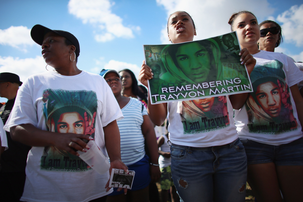Day Of Remembrance Peace Walk Held In Honor Of Trayvon Martin People stand together during the