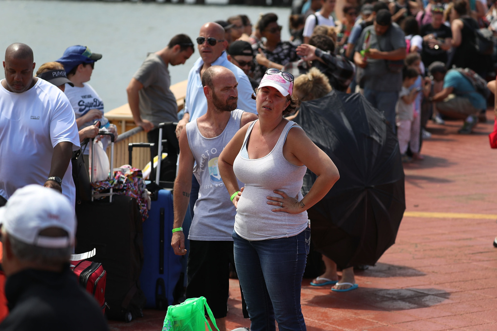 Puerto Rico Faces Extensive Damage After Hurricane Maria Gary Flores and Tabatha Flores stand in line with other people to get on a Royal Caribbean relief boat sailing to Ft. Lauderdale, Florida after Hurricane Maria.