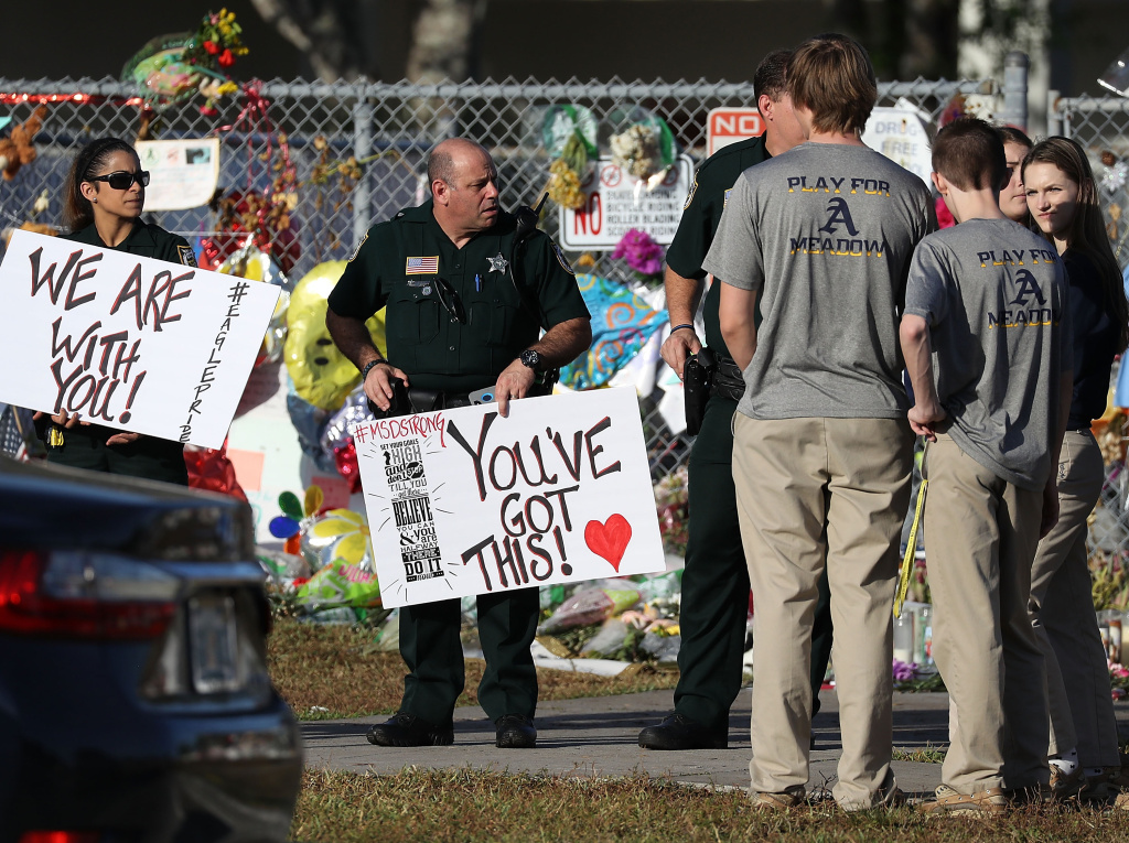 Students Return To Class For First Time After Mass Shooting At Florida School Broward County Sheriff officers welcome students as they arrive at Marjory Stoneman Douglas High School as students arrive to attend classes for the first time since the shooting that killed 17 people on February 14 at the school on February 28, 2018 in Parkland, Florida.