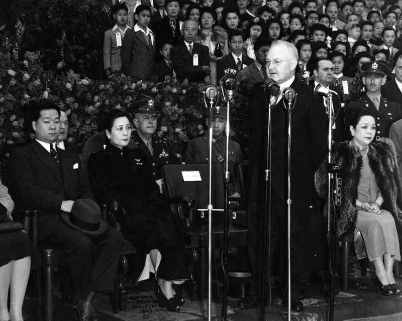 LA Mayor Fletcher Bowron welcoming Madame Chiang Kai-Shek on her visit to Los Angeles on March 31, 1943. Madame Chiang Kai-Shek (seated left, center) was raising funds for China during World War II. Mrs. Bowron is seated behind him. His talk is being broadcast on various radio stations.
LA Mayor Fletcher Bowron welcoming Madame Chiang Kai-Shek on her visit to Los Angeles on March 31, 1943. Madame Chiang Kai-Shek (seated left, center) was raising funds for China during World War II. Mrs. Bowron is seated behind him. His talk is being broadcast on various radio stations.