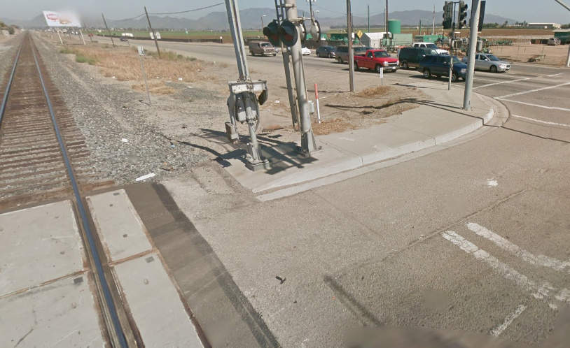 The intersection of 5th and Rice in Oxnard. E 5th St and the train tracks run parallel to each other, and both cross S Rice Av. The intersection of 5th and Rice in Oxnard. E 5th St and the train tracks run parallel to each other, and both cross S Rice Av.