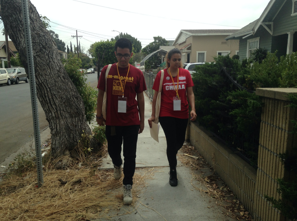 Volunteers Rodrigo Beteta and India Warren do last-minute, get-out-the-vote canvassing for the Coalition for Humane Immigrant Rights of Los Angeles in West Adams on Tuesday morning. Volunteers Rodrigo Beteta and India Warren do last-minute, get-out-the-vote canvassing for the Coalition for Humane Immigrant Rights of Los Angeles in West Adams on Tuesday morning.