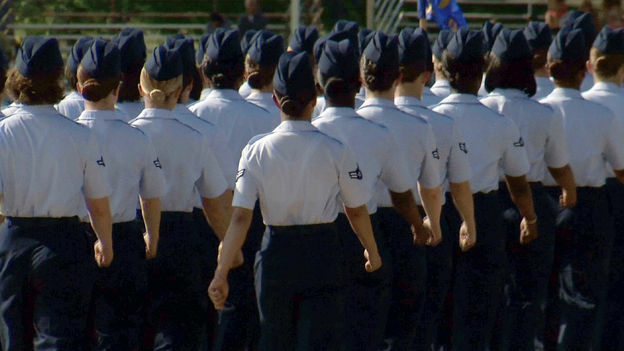 In this June 22 image made from video, female airmen march during graduation at Lackland Air Force Base in San Antonio. A widening sex scandal has rocked Lackland, one of the nation's busiest military training centers. A dozen instructors are being investigated for allegations ranging from abuse to rape.