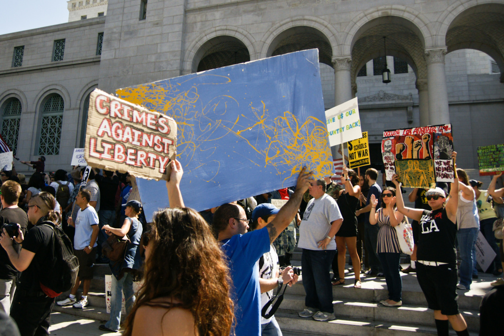 Occupy LA File photo: Participants in Occupy LA rally on the steps of City Hall after marching from Pershing Square. Mayor Villaraigosa now says the protestors have overstayed their welcome.