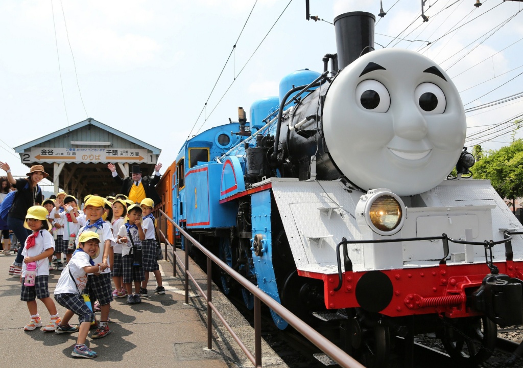 JAPAN-LIFESTYLE-TRAIN-ANIMATION A life-sized Thomas the Tank Engine is surrounded by schoolchildren at Shinkanaya station along Japan's Oigawa railway, in the city of Shimada, west of Tokyo.