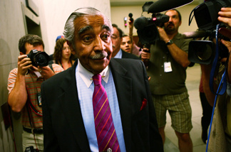 Followed by members of the press, U.S. Rep. Charles Rangel (D-NY) (L) leaves his office for a vote at the Capitol July 28, 2010 in Washington, DC.
