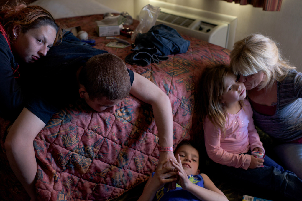 Instagram photographer Vinny, now 16, and his girlfriend (left) visit his younger siblings and mom.