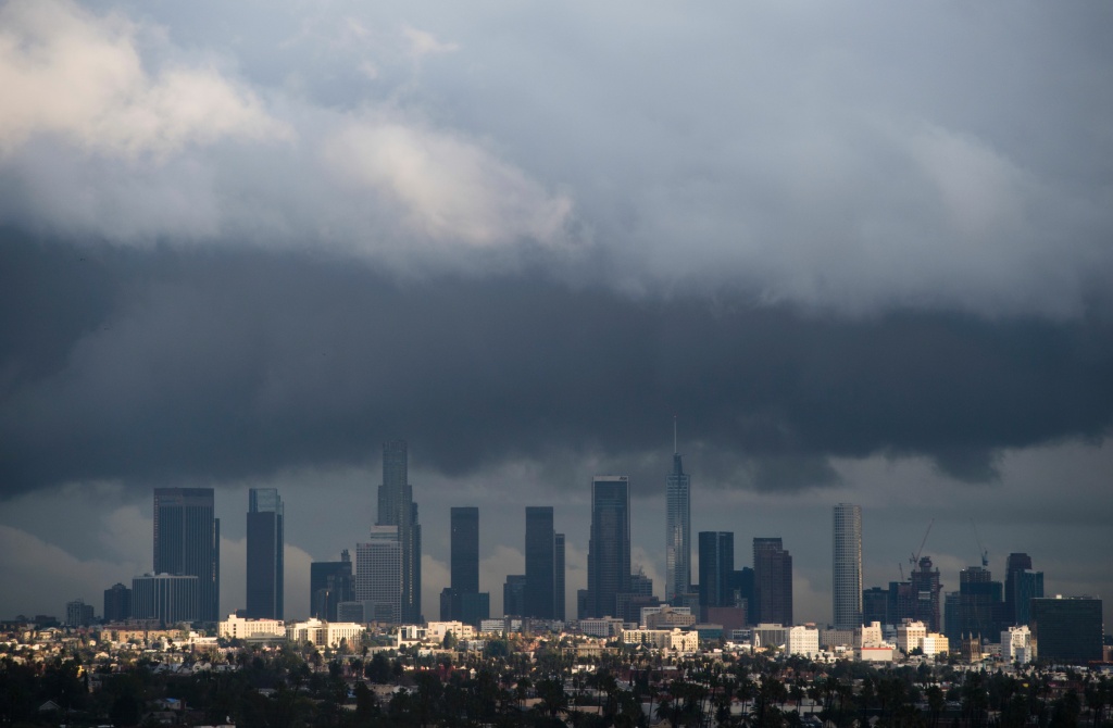 TOPSHOT-US-WEATHER-DROUGHT-CALIFORNIA TOPSHOT - Rain clouds move over downtown Los Angeles, California on January 12, 2017.
A series of storms that have rolled across California in the past week dumping heavy rain and snow could herald the end of a punishing historic drought, officials said. / AFP / Robyn BECK (Photo credit should read ROBYN BECK/AFP/Getty Images)