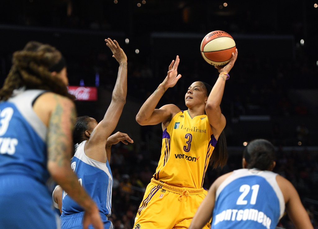 WNBA Finals - Game Three Candace Parker of the Los Angeles Sparks shoots over Rebekkah Brunson and Renee Montgomery of the Minnesota Lynx during the first half of Game Three of the 2017 WNBA Finals.