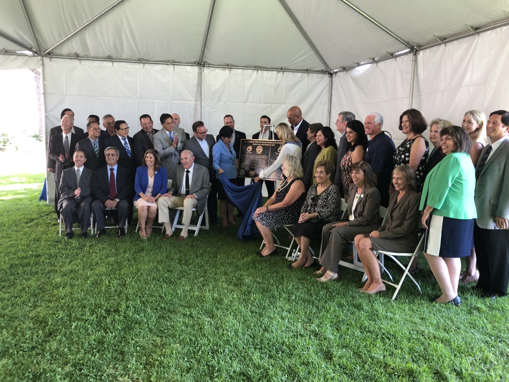 Officials pose as they unveil a commemorative plaque for the new trench. Officials pose as they unveil a commemorative plaque for the new trench.
